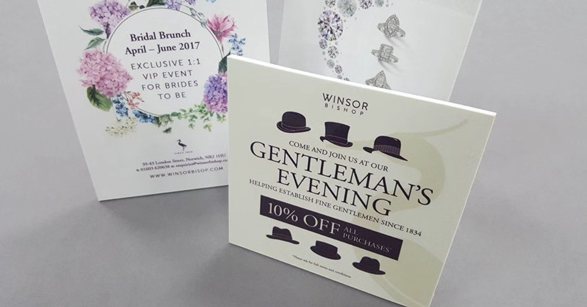 Printed event invitation cards for bridal brunch and gentleman’s evening displayed on a table