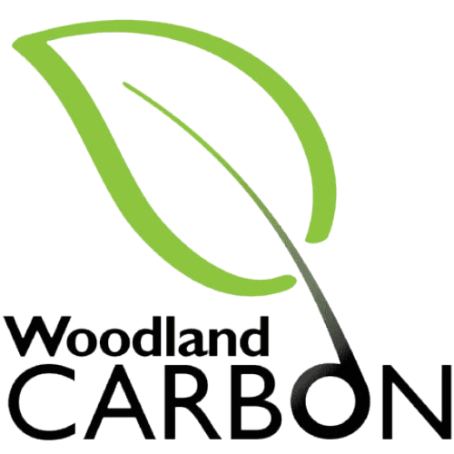 Woodland Carbon logo with green leaf graphic and black text.